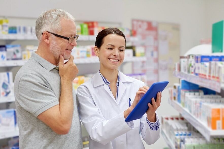A doctor prescribes anti-parasite medication to a man